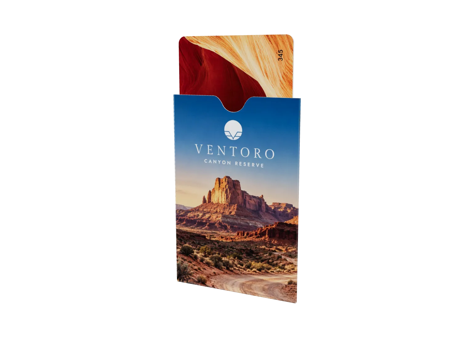 Paper key sleeve printed with a golden-hour canyon and the Ventoro Canyon Reserve sun logo, a red key card standing in it
